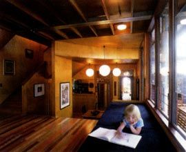 Looking across the living and dining areas, and through to the hall of the existing cottage.