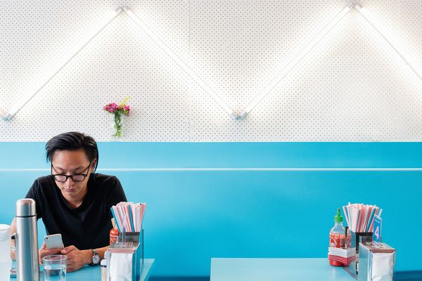 Fluoro lights are arranged in a zigzag pattern over pegboard.