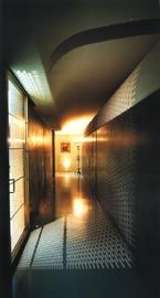 Evening view of the entrance
hall, with light cast through the entry screen and fibre-optic lights recessed into the floor.