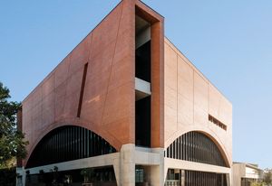 The oversized arches, with their black mullions and dark glass, recall both Louis Sullivan’s National Farmers’ Bank of Owatonna and the Harbour Bridge.