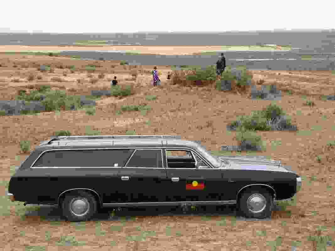 Mungo Man’s remains arrived home in a 1976 black Chrysler Valiant hearse.