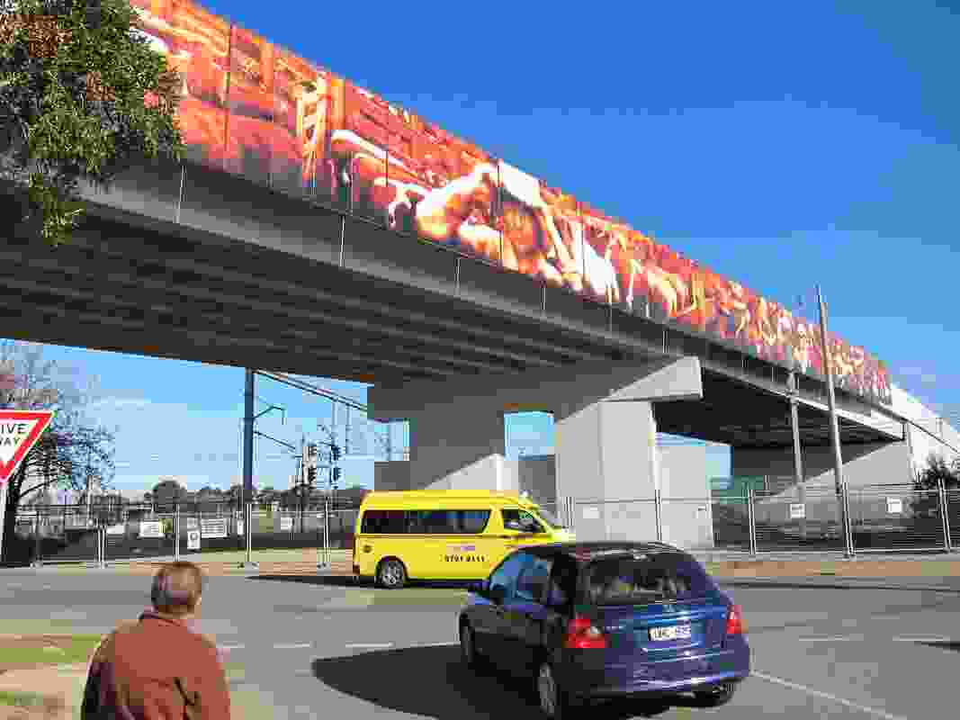 Stock Yard, an artwork by Sinatra Murphy mounted on both sides of the Stockmans Bridge in Dandenong, depicts the story of the area’s former stock market.