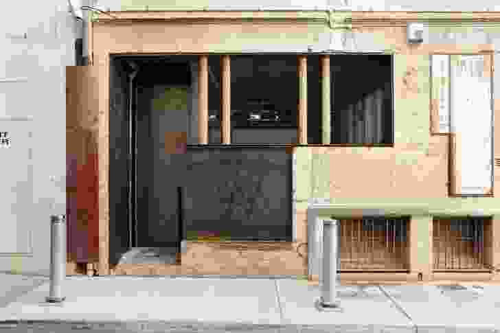 The large custom-made steel barn door opens the bar onto the lane.