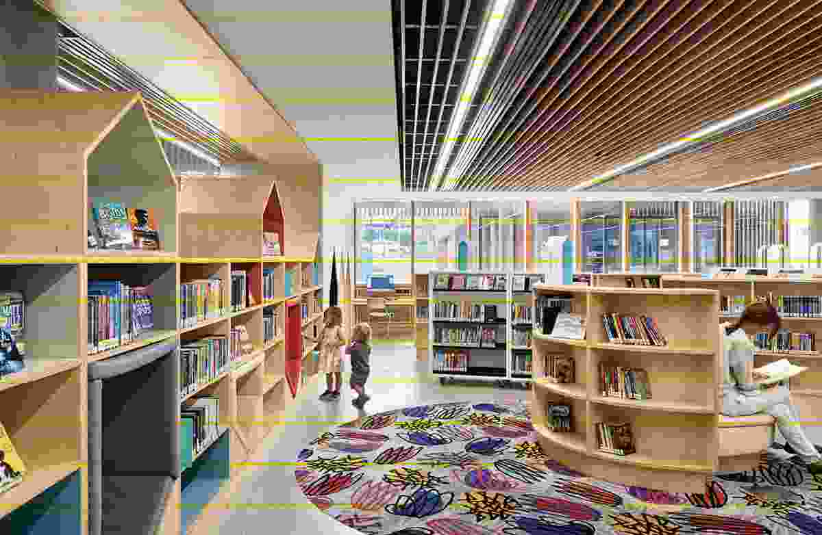 The scale shifts in the children’s area, with its low shelving and upholstered nooks.