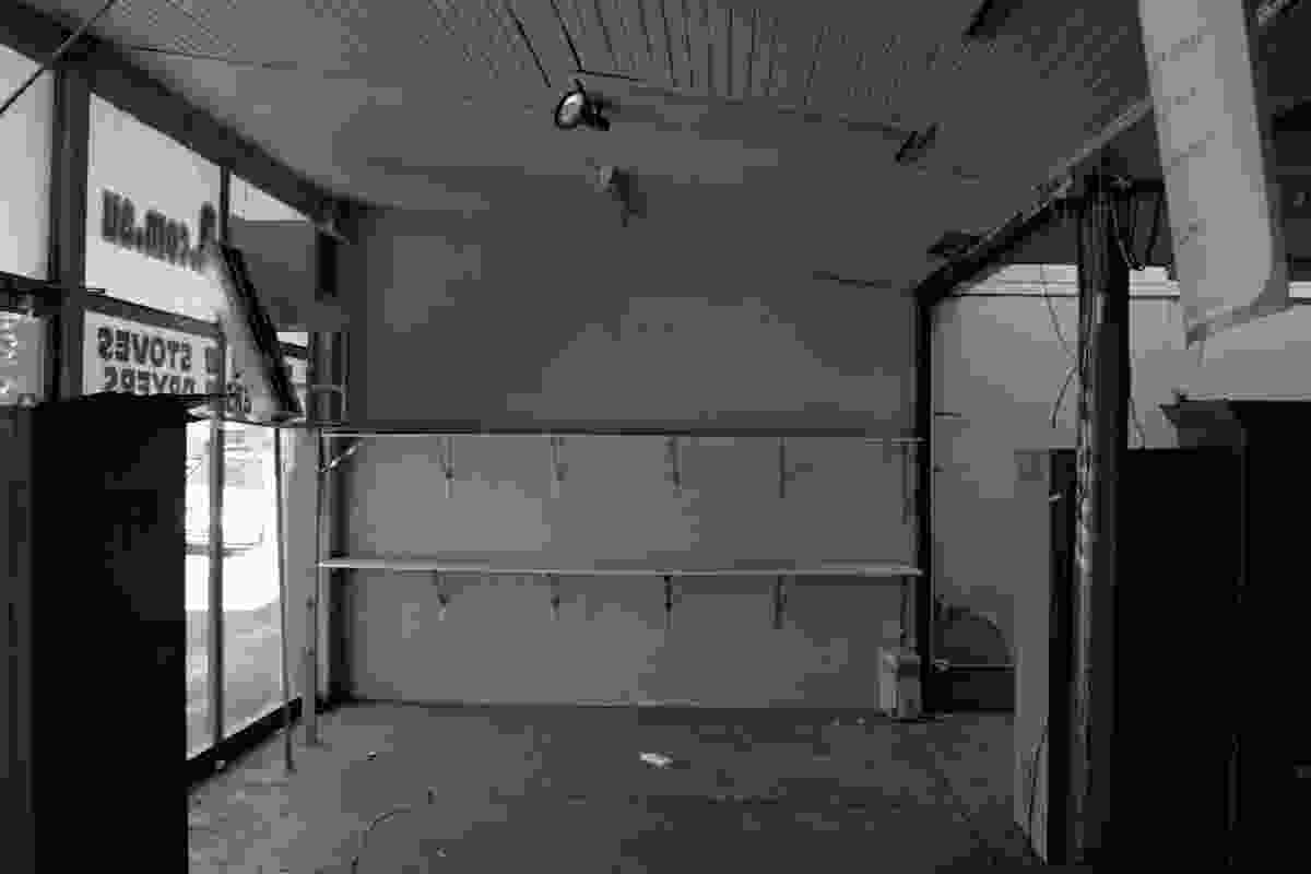 Interior view of condition of showroom prior to restoration.