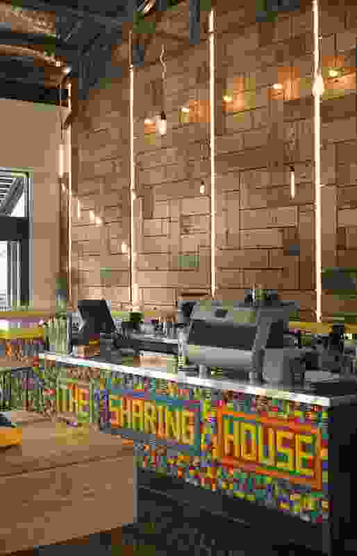 The Sharing House: A lego-clad bar contrasts with wharf timber on the wall behind.