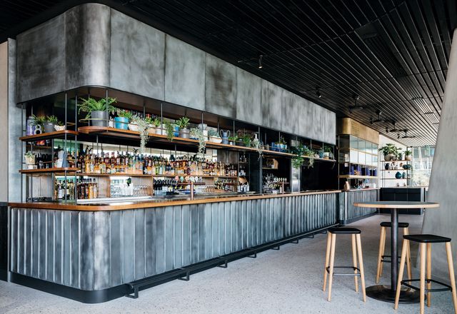 On the ground floor, House Bar features a patinaed copper bar at the rear of the space and seating with views to the harbour.