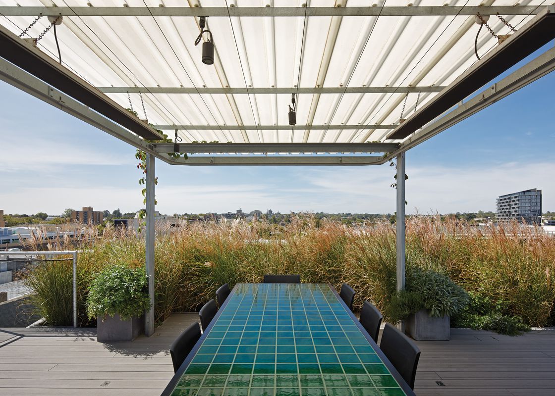 17 Rooftop Deck Ideas and Designs - Trex - Glass-Enclosed Rooftop Deck Design