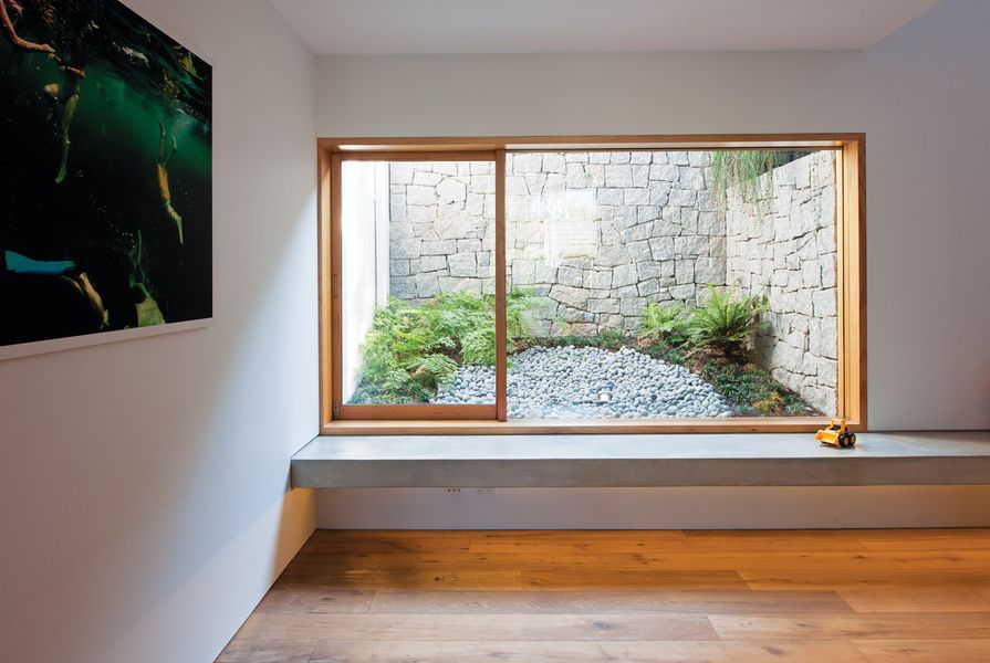 A window into a courtyard on the lower ground level acts as a light well.
