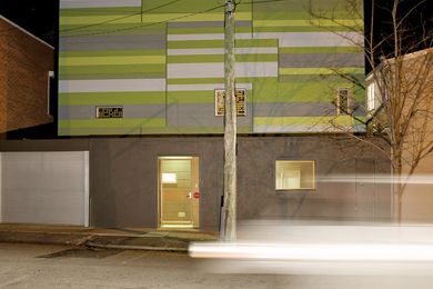 WW House – Green, white and grey patchwork rectangles on the facade are like a traditional buzz-cut front lawn that has been folded and pinned to the house. 