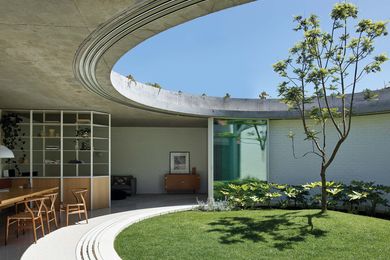 A circular courtyard is the centrepiece of the extension, bringing light and ventilation to the living spaces.