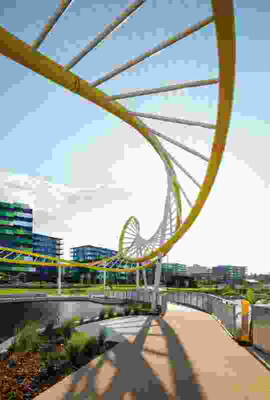 A sculptural arbour, reminiscent of the DNA double helix, swerves around the heart of the Games Village at Parklands, which forms part of the Gold Coast Health and Knowledge Precinct.