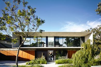 Essentially a concrete frame to a wall of glass, the large upper level flares outwards like an elegant aperture for observing the world.