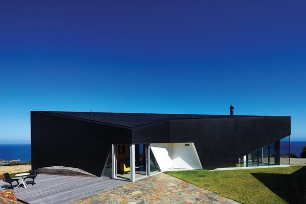 As a black object in the landscape, the house has gravitas beyond its size.