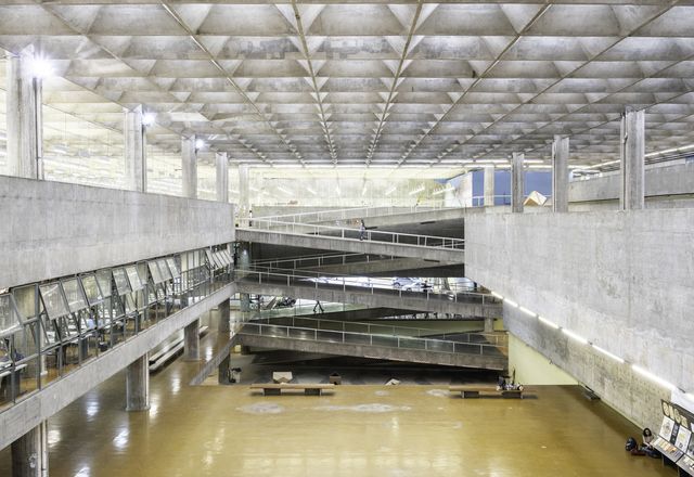 FAU-USP features a vast atrium illuminated from above through a sublime textile of interlocking concrete elements.