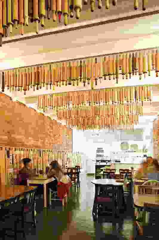 Hundreds of rolling pins hang above diners, giving a cosy homestyle-kitchen feel to the restaurant.