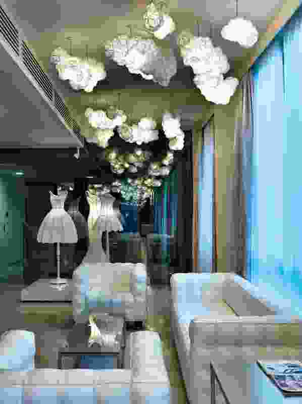 The lobby with cloud-like lights and lampshade dresses.
