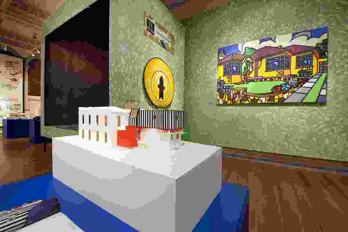 Howard Arkley’s Family Home hangs beside the stage installation in the Gallery’s main space.