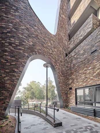 The "mouse hole" in Arkadia by DKO Architecture and Breathe Architecture is two storeys tall.