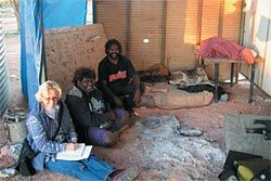 Anthropologist
Sarah Yu consulting
with community
members.