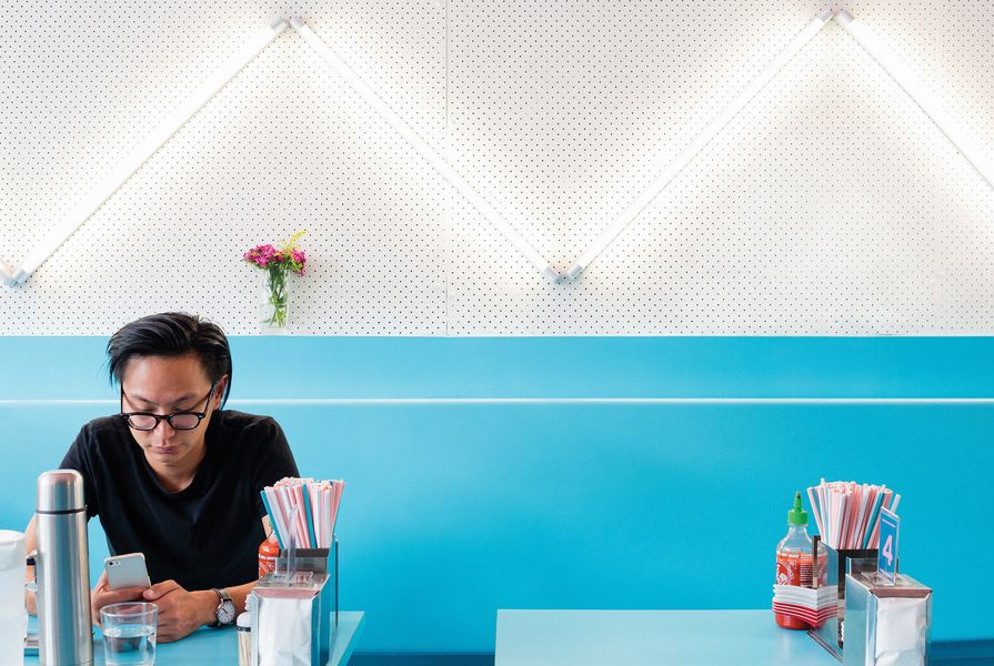Fluoro lights are arranged in a zigzag pattern over pegboard.