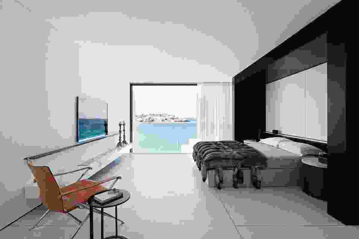 The main bedroom faces the beach and is separated from the dressing room by an ensuite.