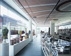 Interior of the bookshop, with  Mardayin at Milmilngkan, 2006, by John Mawurndjul on the ceiling. Image: Philippe Ruault