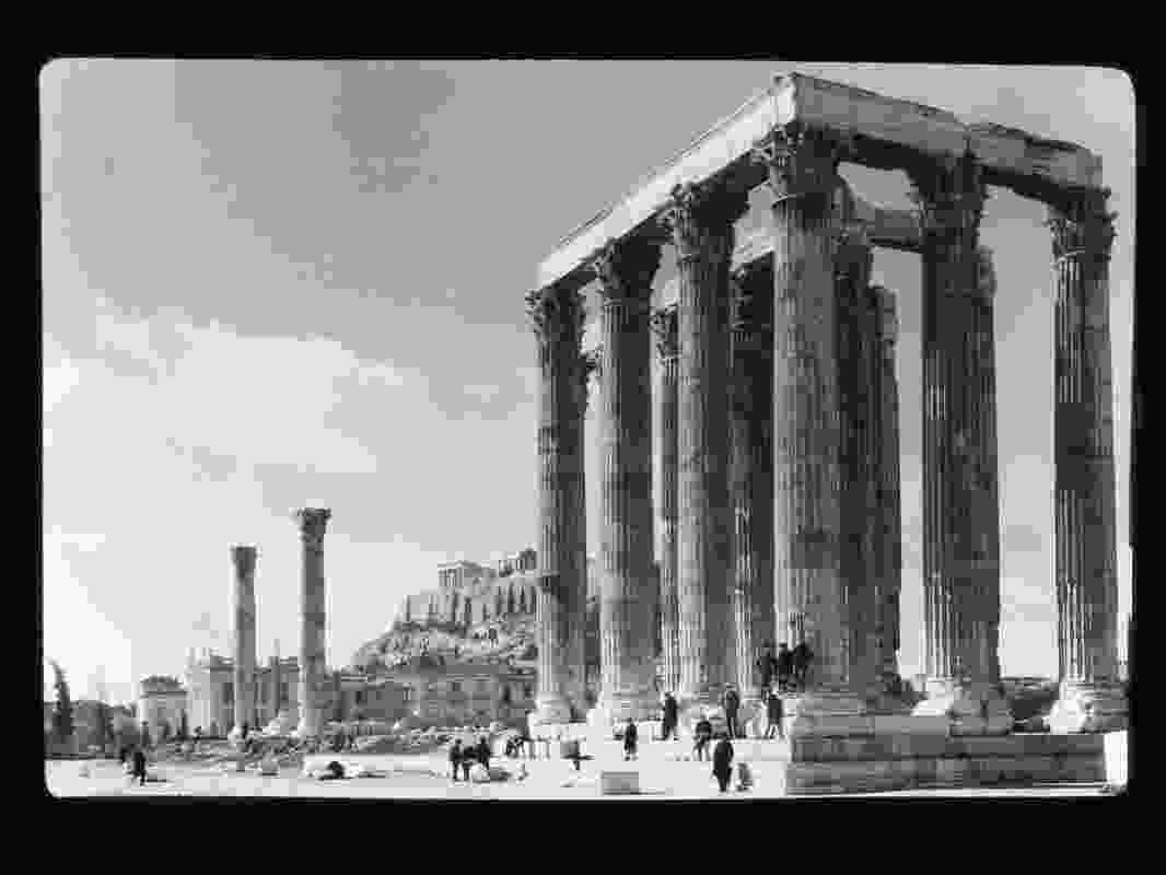 Classical style ruins, location unknown [Temple of Zeus, Athens, looking back from the southeast corner at the Acropolis with the Parthenon temple above], ca. 1900–1930.
