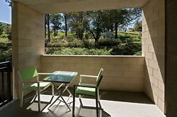 A private, semi-enclosed balcony space showing the framed view to Grey Gums Park beyond. Image: Graham Philip 