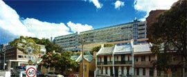 Western
elevation, seen from Paddington against the
surrounding fine-grain urban fabric. The
screened inpatient floors can be seen above
the line of the existing buildings and trees.