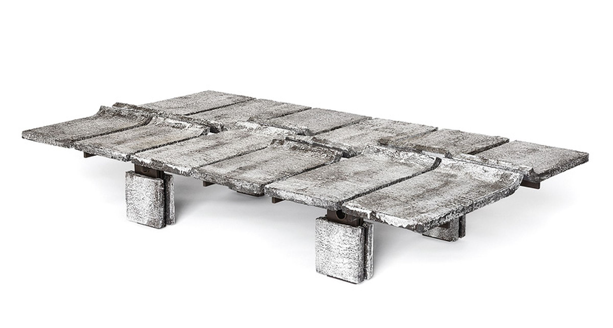 Cameron’s Oblique table is composed of handmade, curved ceramic tiles reminiscent of roof shingles.