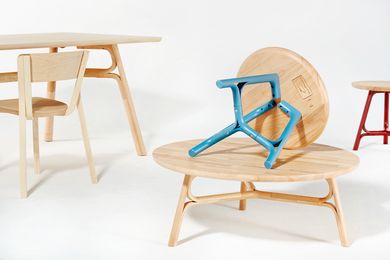 Justin Hutchinson Flow tables for Dessein Furniture in natural rubberwood and blue.