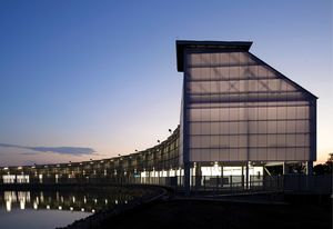 The lantern-like entry tower exaggerates the scale of the building and celebrates its structure.
