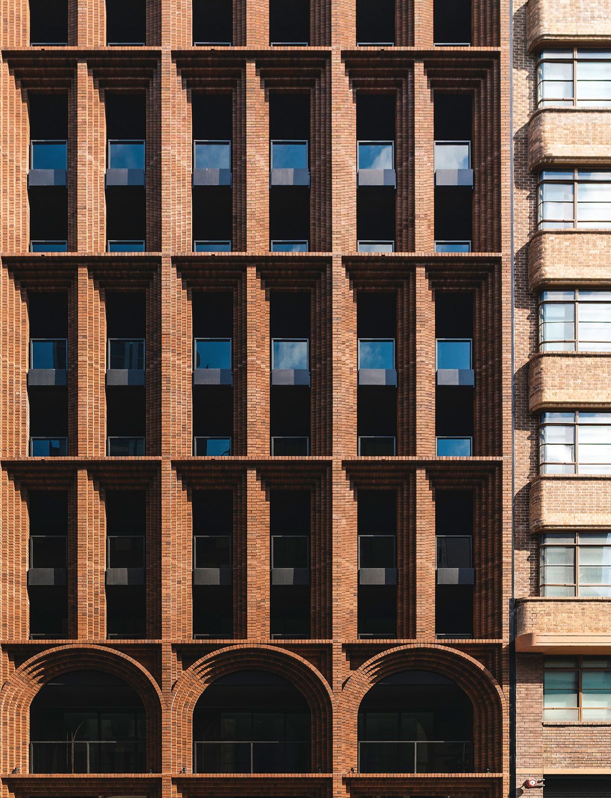 High Rise Arches Tall towers amid brick warehouses: Arc | ArchitectureAu