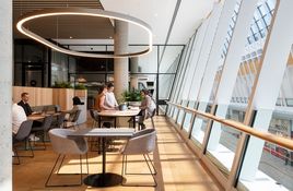 The design responds to a voluminous retail atrium and barrel-vaulted ceiling.