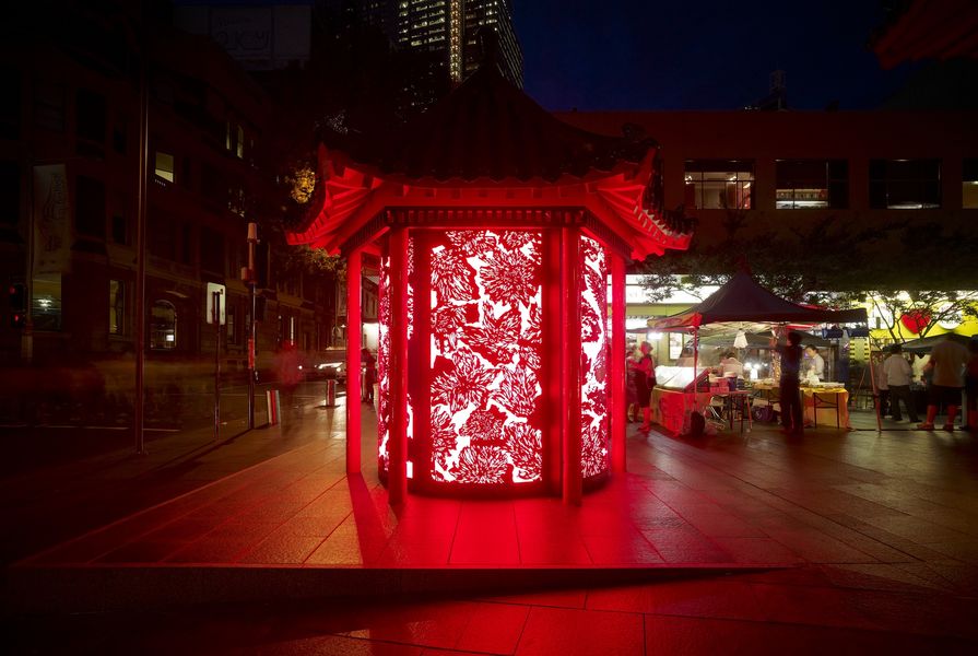 A seating pagoda in Sydney's Chinatown has been transformed into a patterned red lantern that houses tourist information. Designed by Lacoste + Stevenson and Frost* Design.