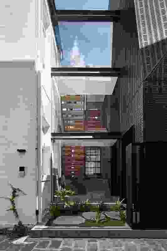 The new stair acts as a quasi-extension of the public laneway.