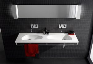 Generous storage space and an elegant chrome-plated hand towel rail deliver convenience with Laufen's new double washbasin.