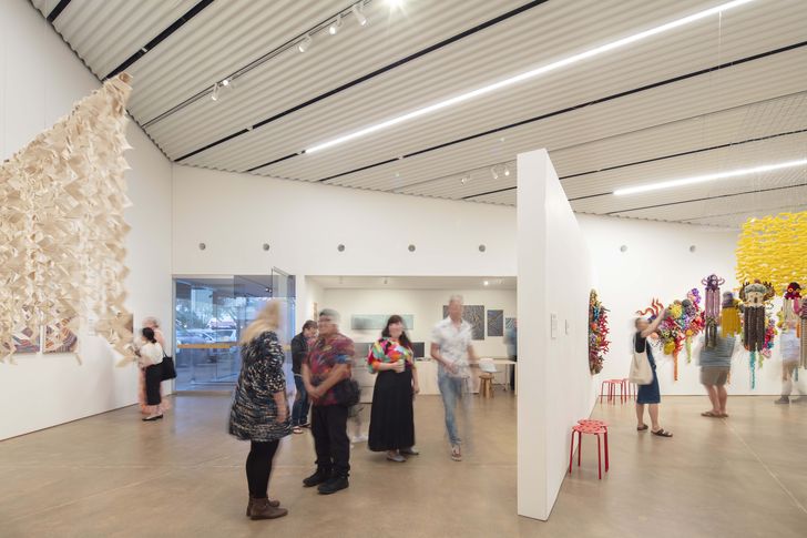 The vaulted interior has a single pivoting wall to cordon off or divide the space, providing flexibility for the curators. Artwork (L–R): Jacky Cheng, Selena Brown, Daisy Tinker, Sandra Francis, Donovan Brown, Ruby Djikarra Alderton, Paula do Prado