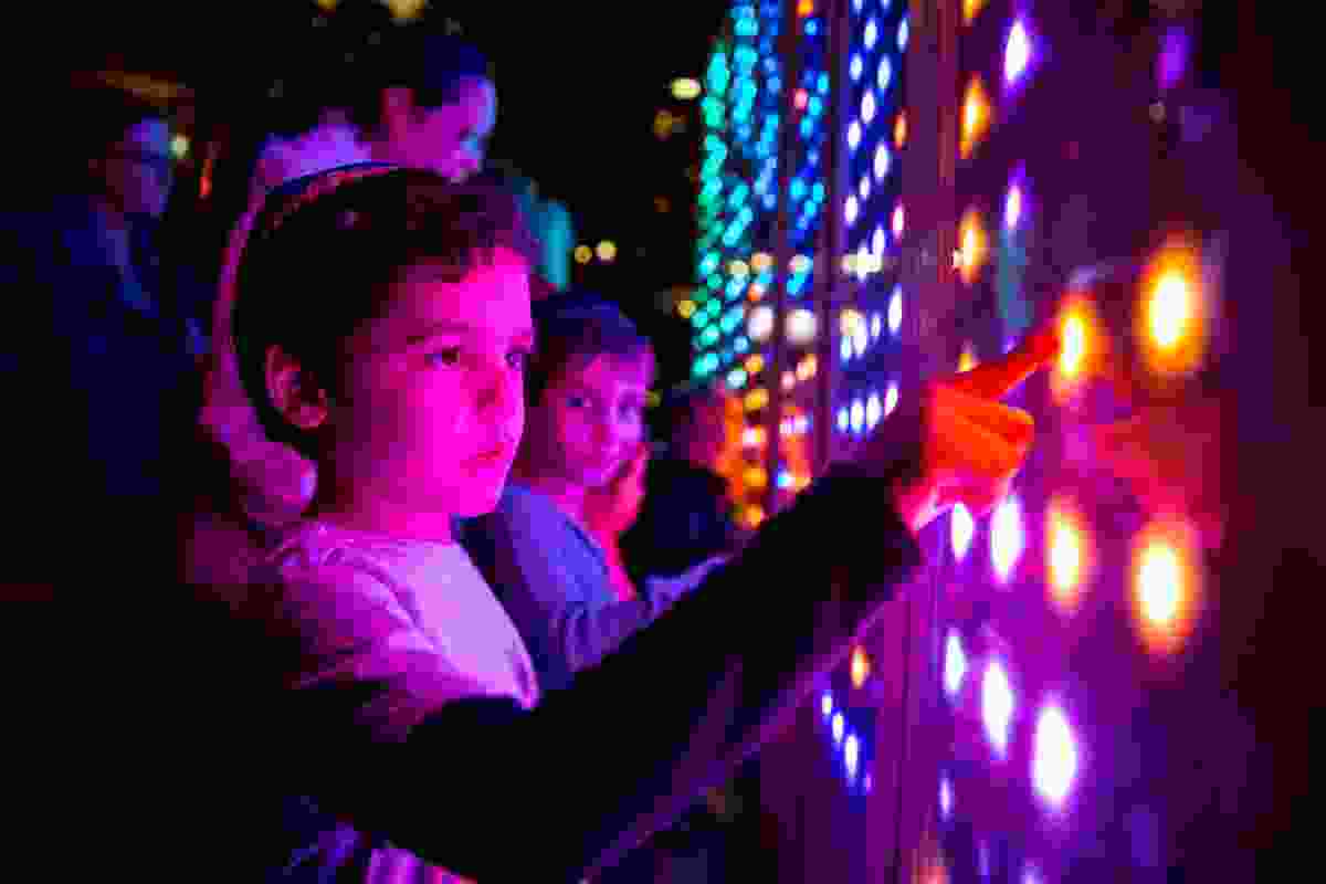 Children interacting with the Chromatic Motions installations at 2013 Vivid Sydney.