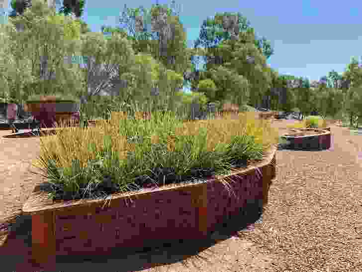 The planters fabricated for the Weaving Garden bear representations of plants the Yorta Yorta people traditionally use for weaving.