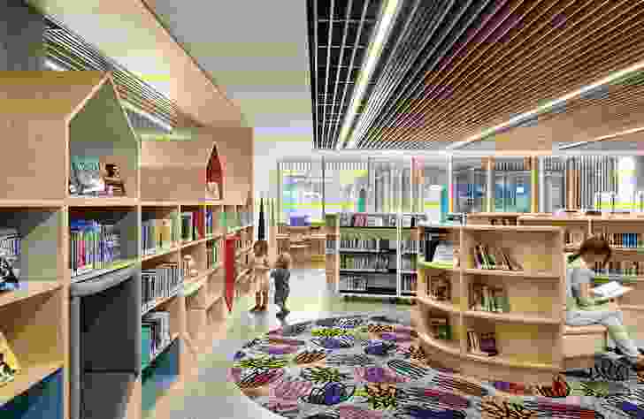The scale shifts in the children’s area, with its low shelving and upholstered nooks.