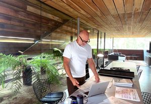 Nik Karalis, CEO of Woods Bagot, working from home.
