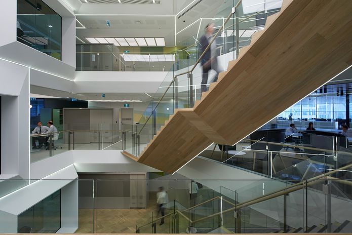 Each three-storey atrium is linked to the one above by a secondary stair.