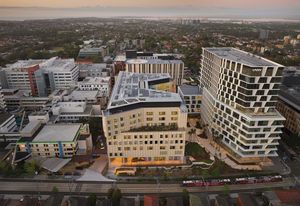 The building’s huge program is arranged across stacked C-shaped floor plates framing an internal courtyard.