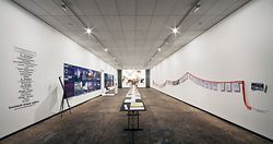 Installation view: panels by Dale Jones-Evans on the left, exploratory drawings by Peter Stutchbury on the right and Lacoste + Stevenson’s A3 sketchbooks in the foreground, with Terroir’s models on the far wall.