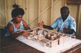 Hobson and Anna Levi with a cardboard model of their new home, Torres Strait, 1986. Photograph Paul Haar. 