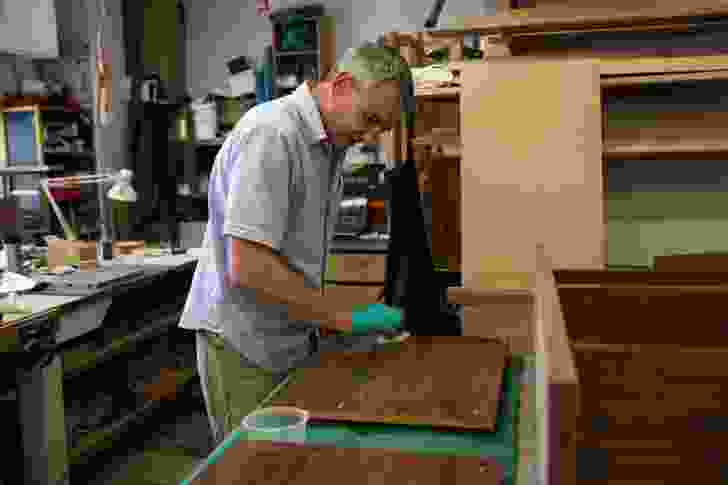 Andrew Bartlett applying finishing coat to a commission before final assembly.