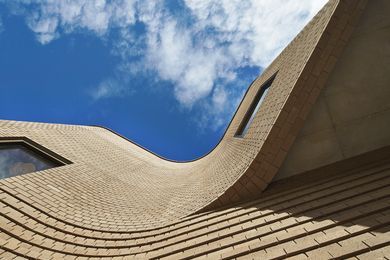 The Learning Commons’ curvilinear brick walls add to the handmade, “tapestry-like” quality of the buildings.