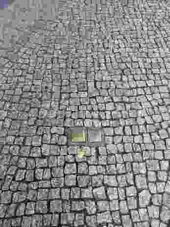 Wounds in the city fabric: stumbling stones in Berlin mark the lives of Holocaust victims and where they once lived.